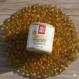 Pot d'omega-3 mulebar au milieu de capsules jaunes